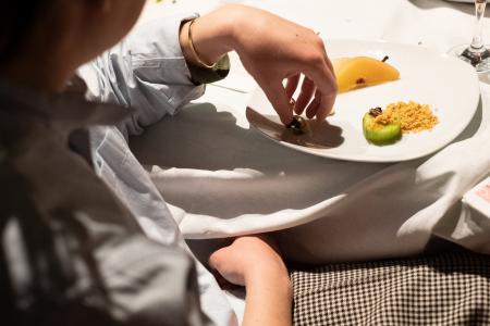 Cuisine (du) Terror in Sofia, Bulgaria. A guest interacting with the dessert  Cuisine (du) Terror in Sofia, Bulgaria. A guest interacting with the dessert